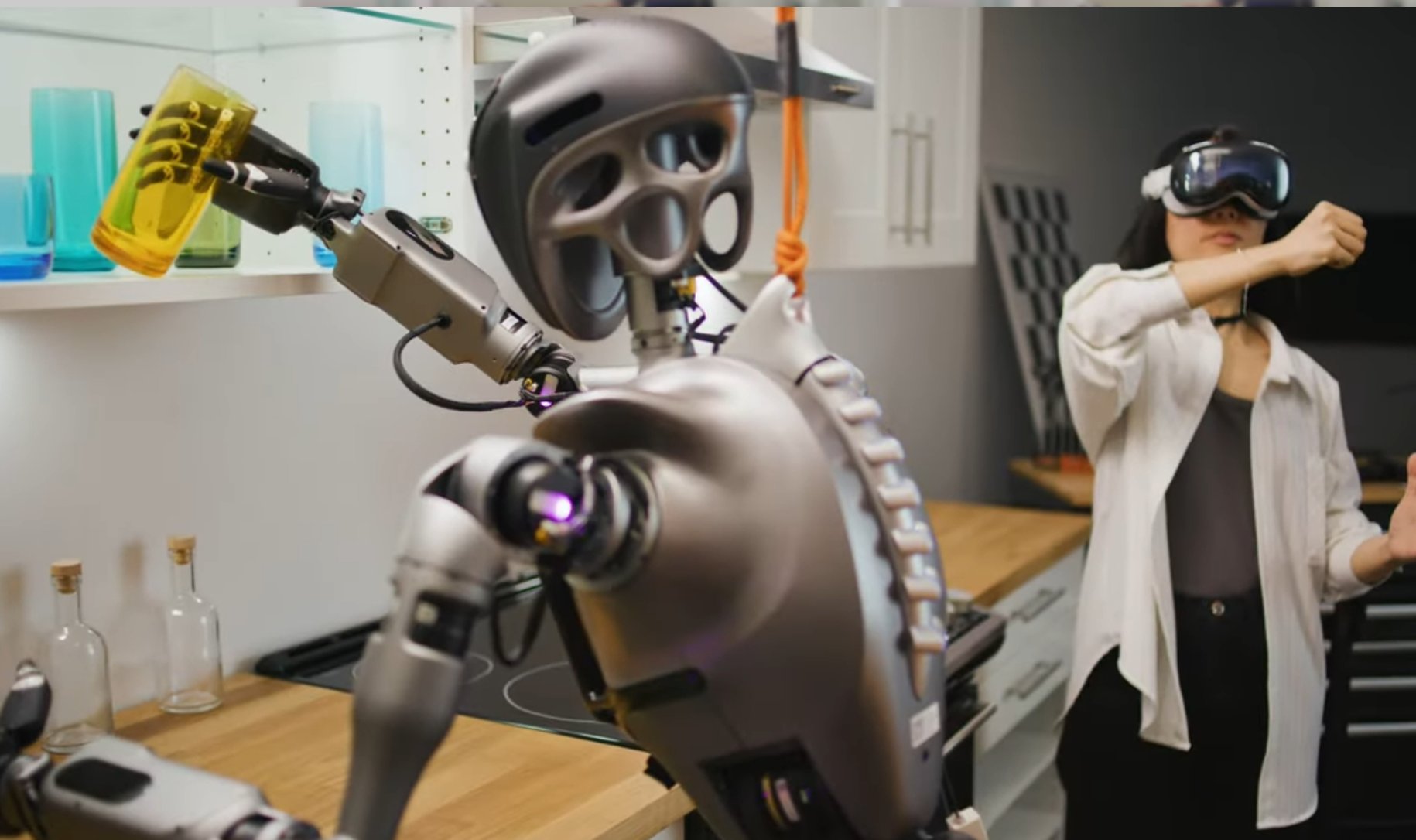 用户通过 Vision Pro 操控人形机器人在厨房取物